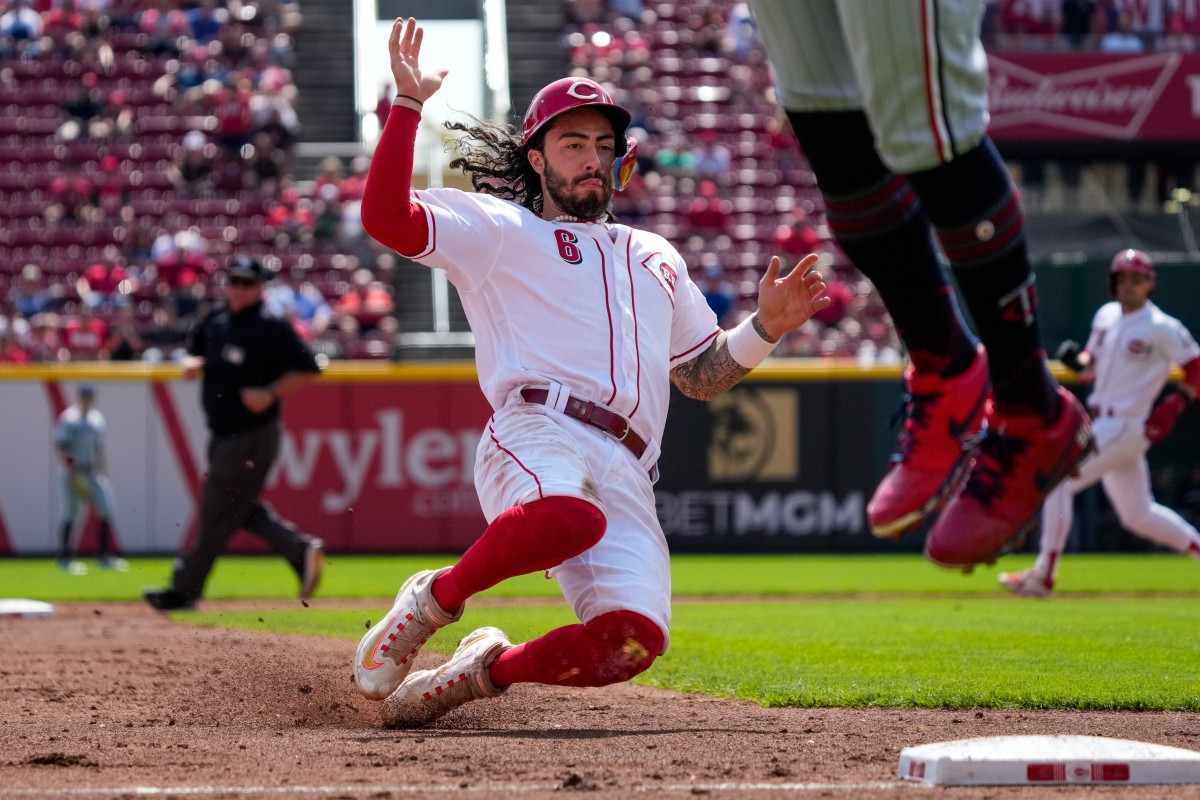 Cincinnati Reds second baseman Jonathan India (6) slides into third after Spencer Steer flies out in the third inning of the MLB Interleague game between the Cincinnati Reds and the Minnesota Twins at Great American Ball Park in downtown Cincinnati on Wednesday, Sept. 20, 2023.  
